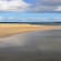 The sandy shoreline on the Orkney Coast
